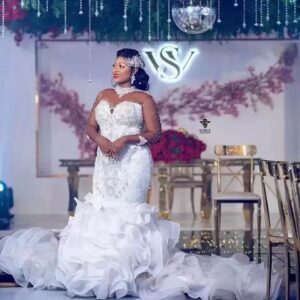 elegant beaded bridal gown ruffled train crystal details