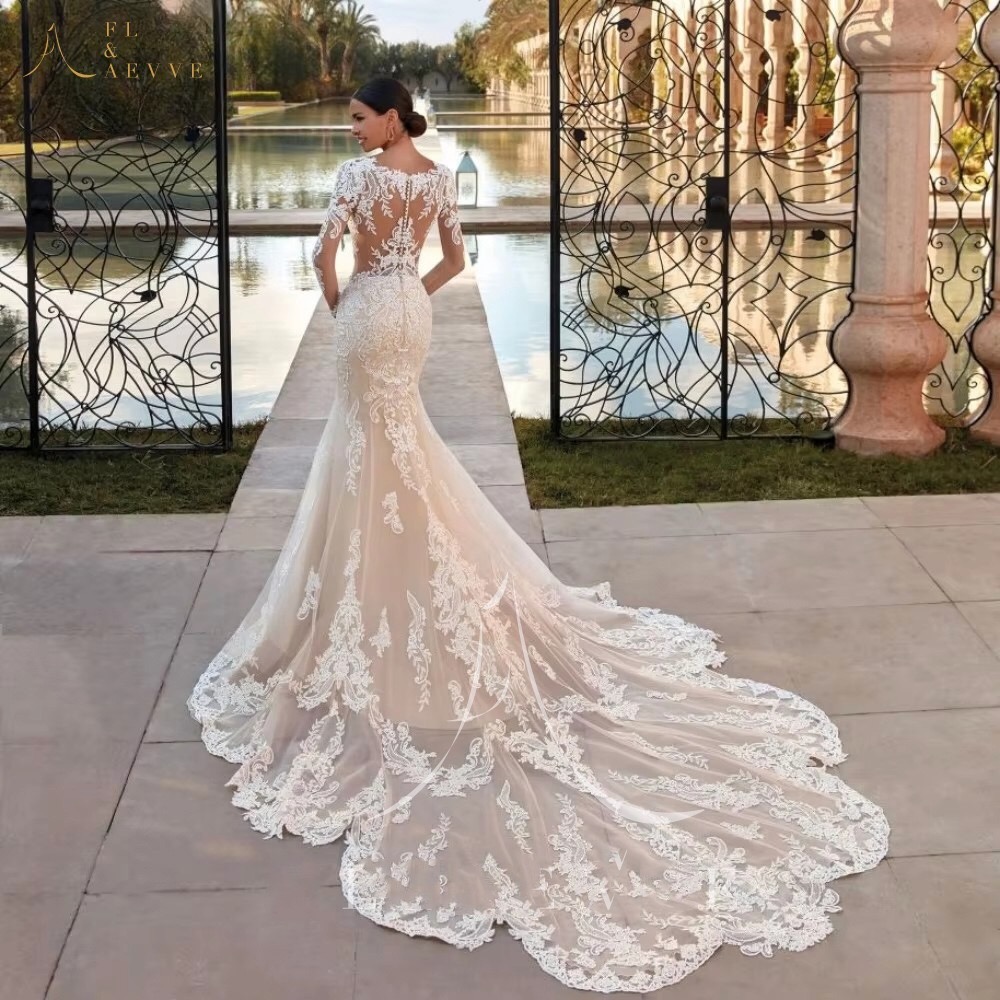 Long sleeve illusion champagne wedding gown