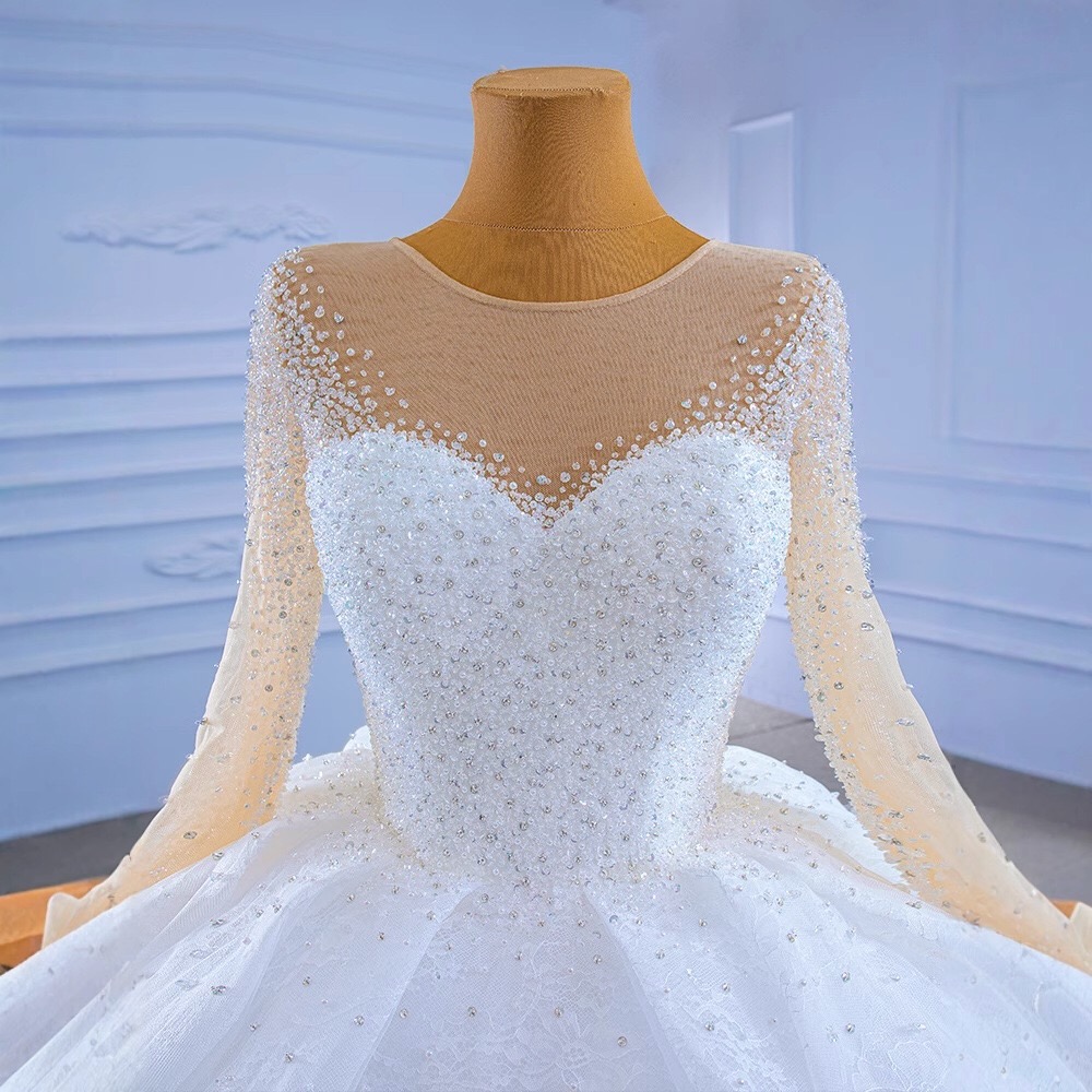 beaded bodice illusion long sleeve ball gown wedding dress