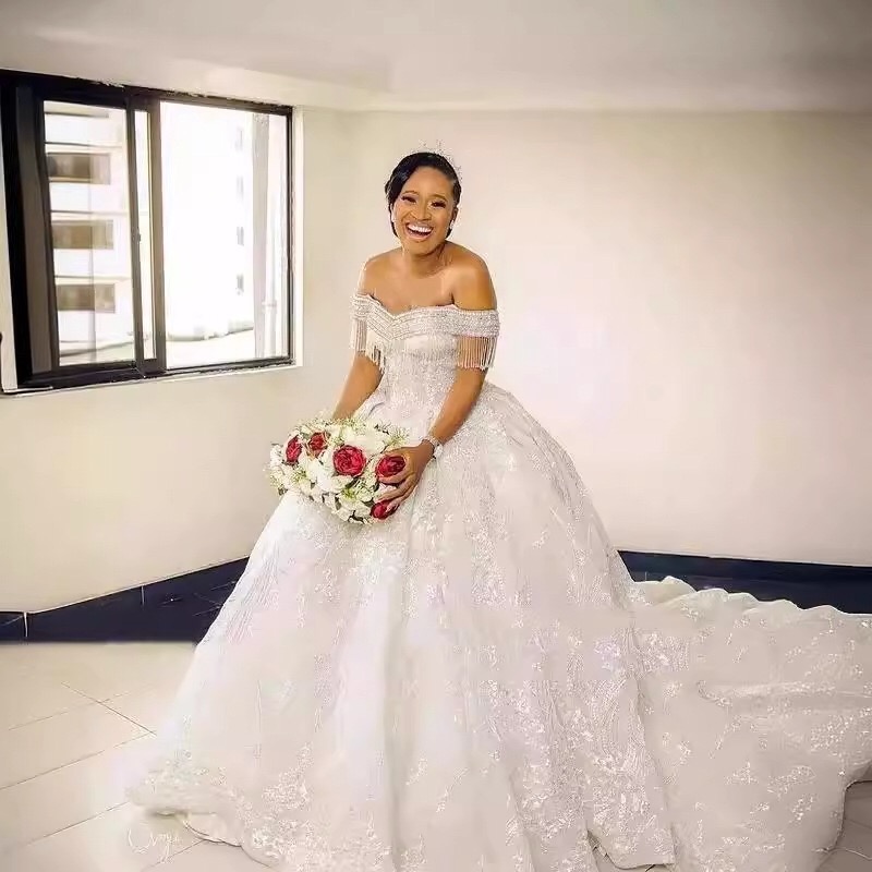 off the shoulder beaded fringe ball gown wedding dress