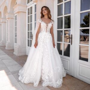 elegant-off-shoulder-wedding-dress-with-applique-and-streamer-cape